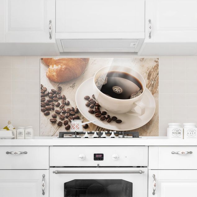 panel-antisalpicaduras-cocina Steaming Coffee Cup With Coffee Beans